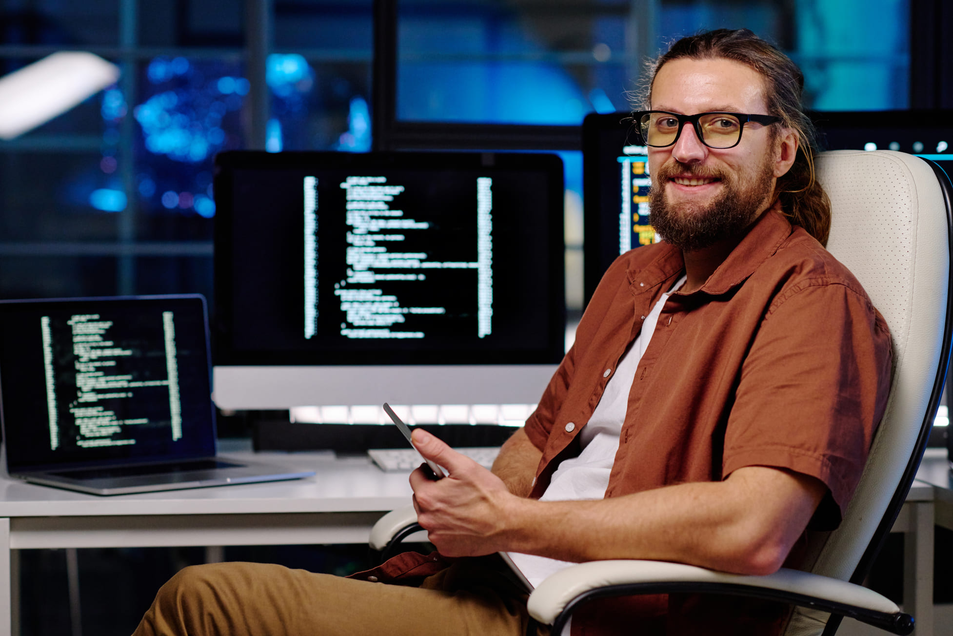 young-smiling-male-it-engineer-in-eyeglasses-using-2023-04-04-18-49-50-utc